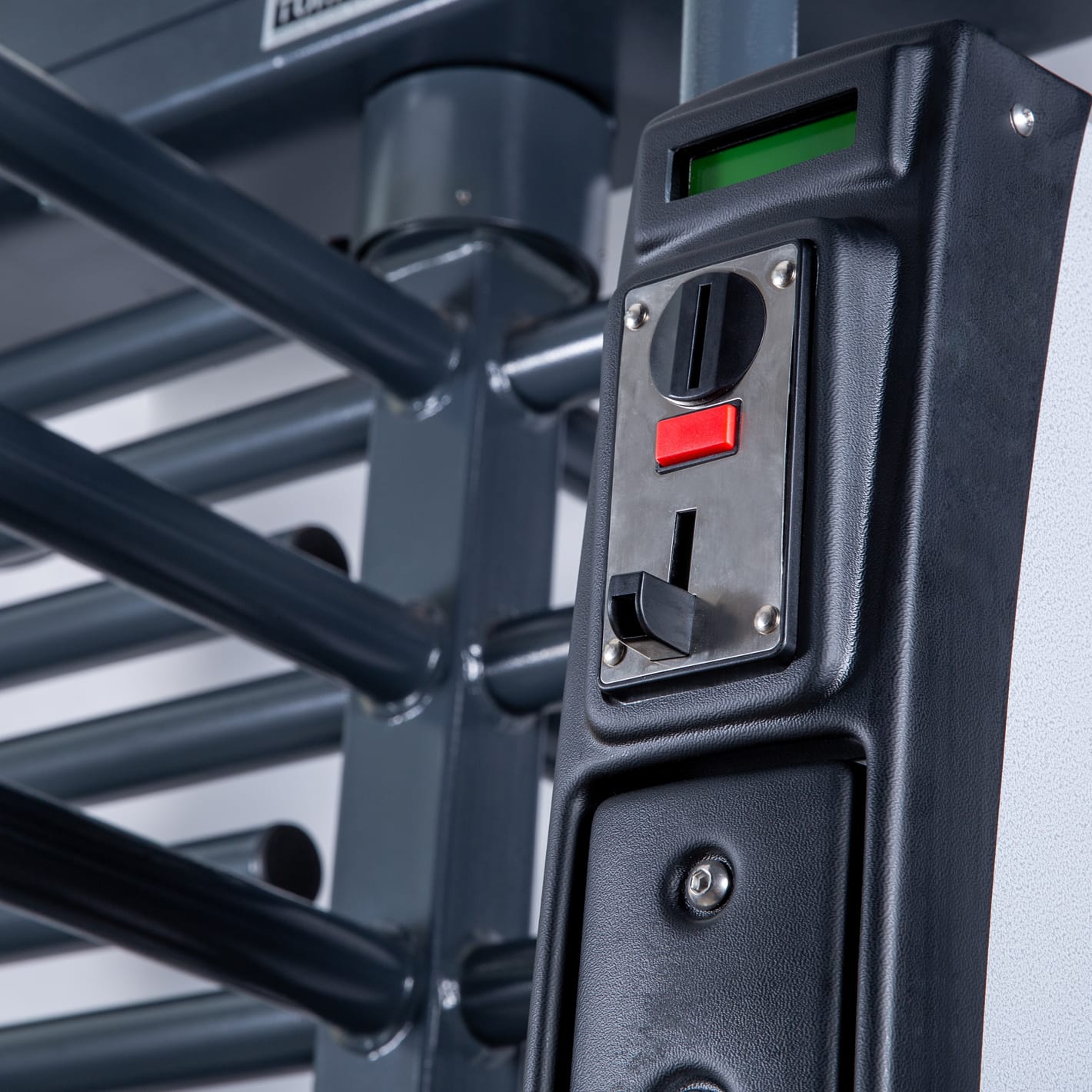 Close-up of the coin slot and display on a turnstile coin acceptor.