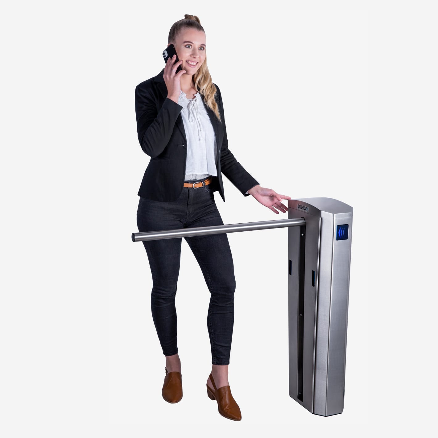 Woman on the phone walking past the arm of a stainless steel Dynamic drop arm barrier.