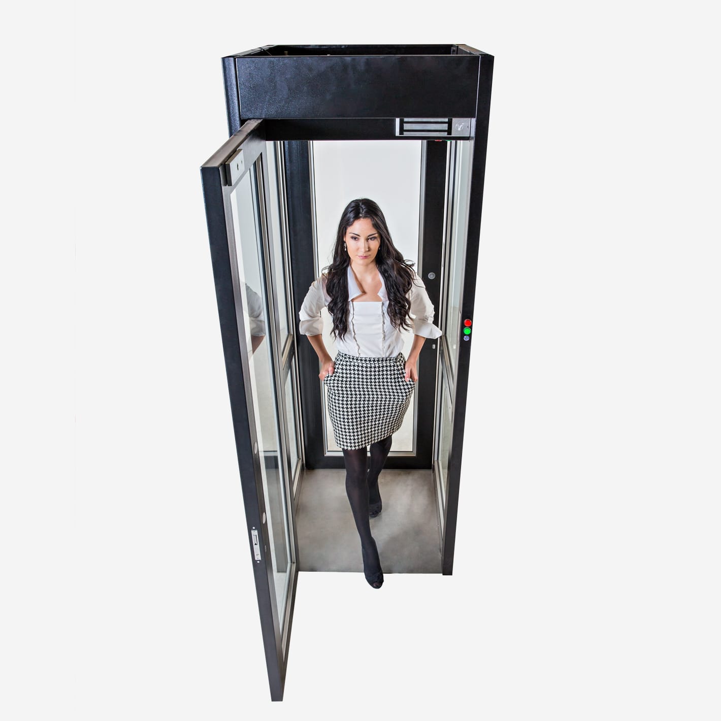 Front view of a woman walking out of an open mantrap cubicle door.
