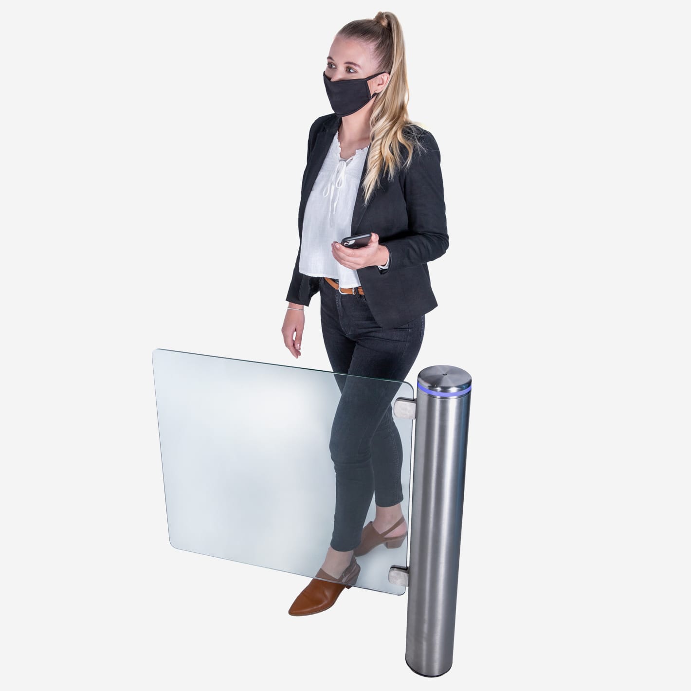 A woman in a face mask passes a Pulse gate with its glass wing swung open.