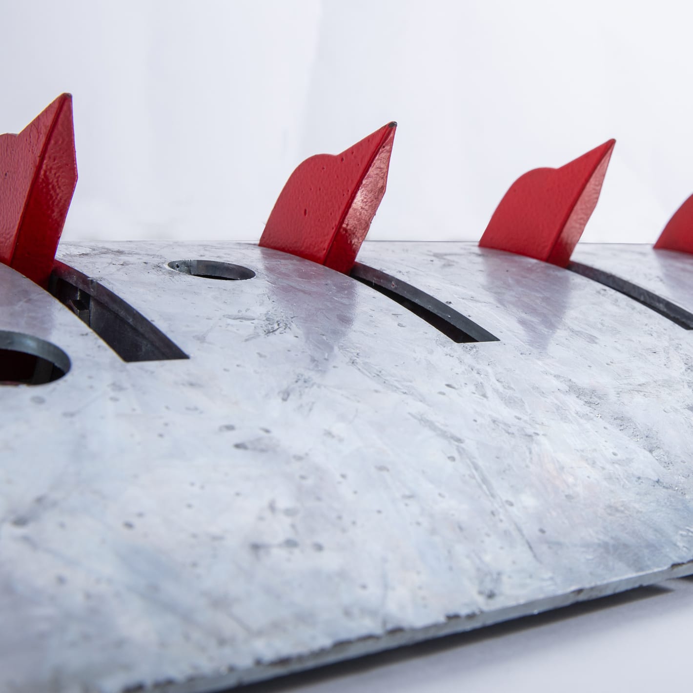 Close view of the red one-way spikes standing in the galvanised Talon rack.