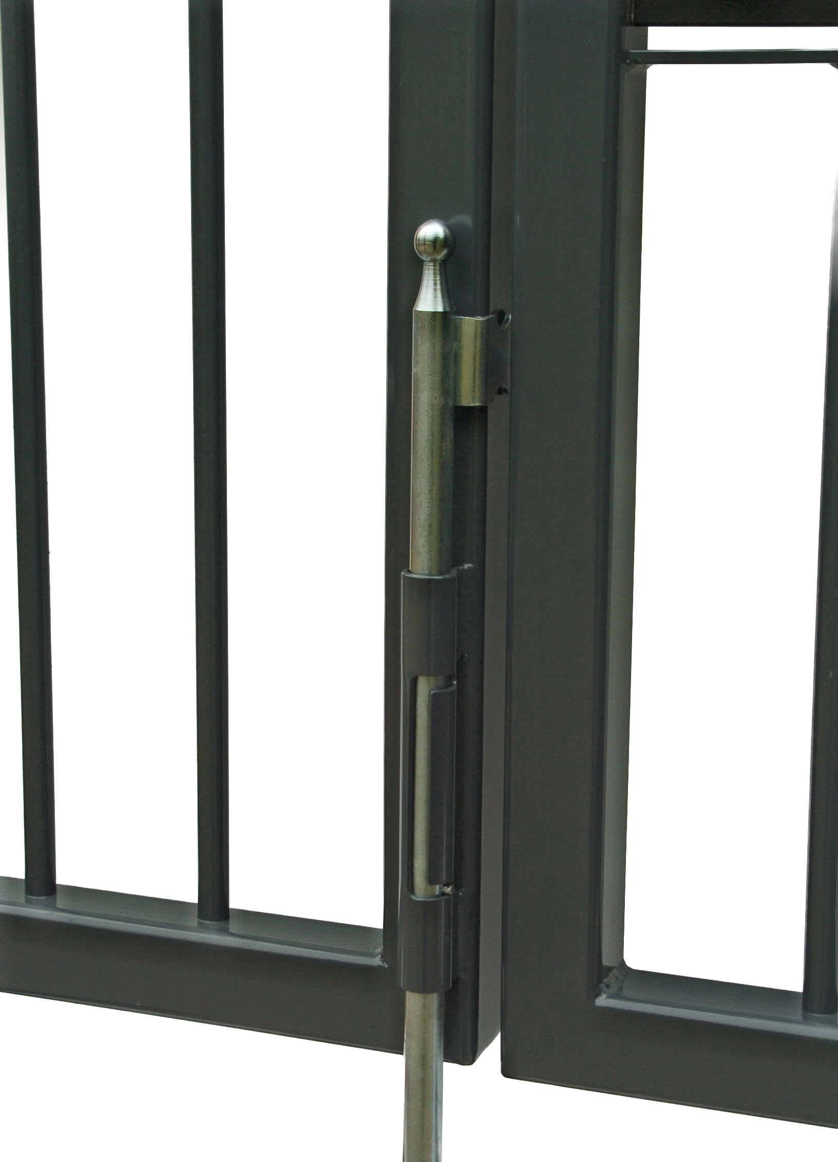 The drop bolt between the two leaves of a closed double gate, its lifting plate held behind the meeting stile