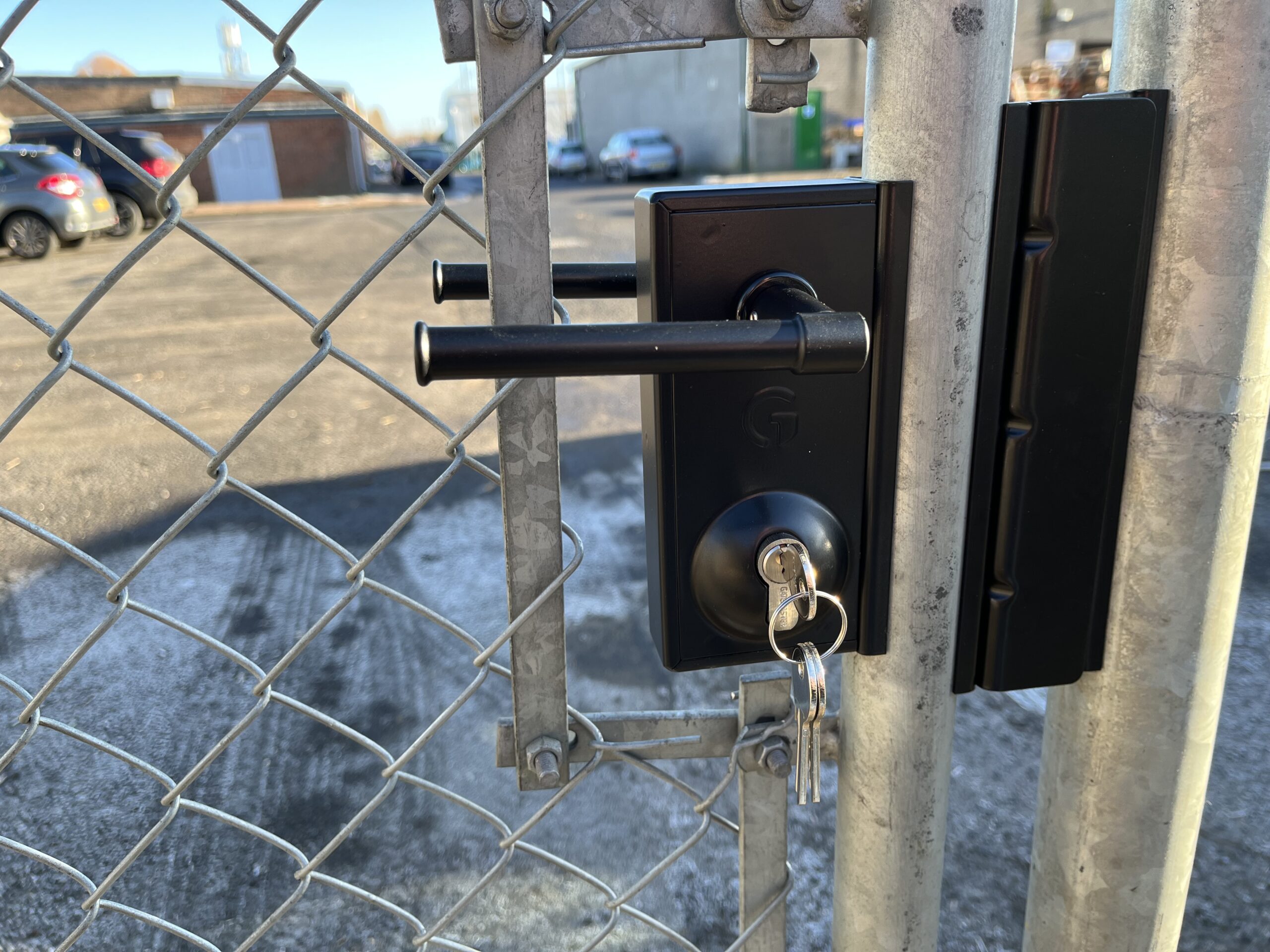 Gatemaster Superlock Round Bar Adapter, the adapter carrying a lock on a round bar gate frame