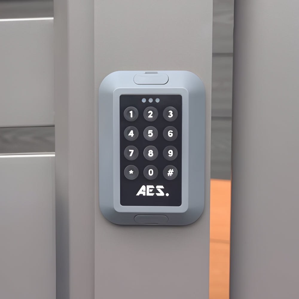 AES wireless e-Keypad mounted on a grey gate post, front view