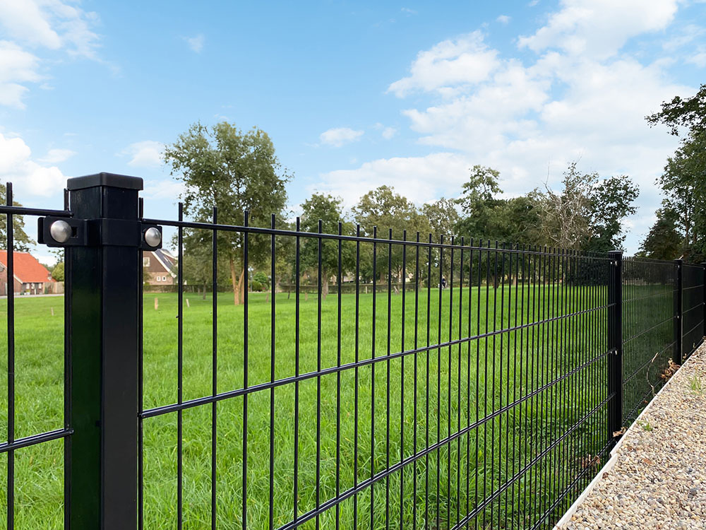 Double wire fence panels on posts with brackets forming an enclosure