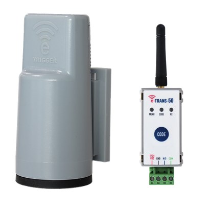AES e-Trigger kit: grey e-Trigger transmitter beside an eTrans 50 transceiver with antenna