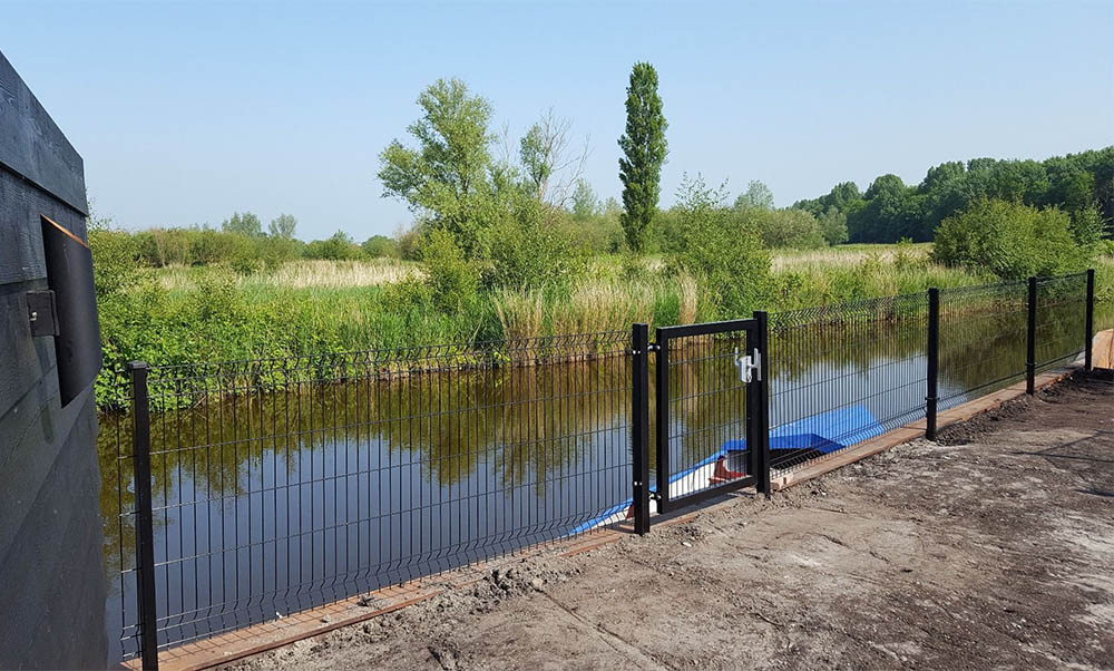 V mesh fence installed along a boundary