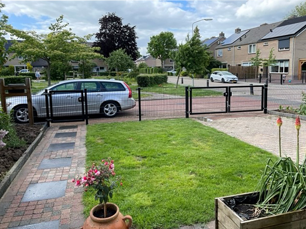 Professional double leaf gate installed in a panel fence