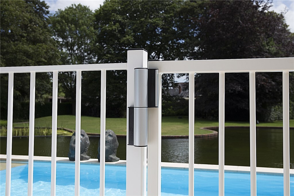 Silver Tiger gate closer on a white pool fence gate