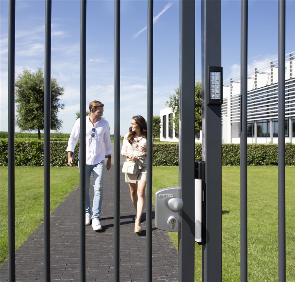 People walking through a gate with a Locinox SlimStone-2 keypad