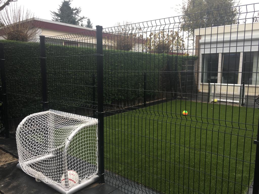 V mesh panels used around a small sports cage