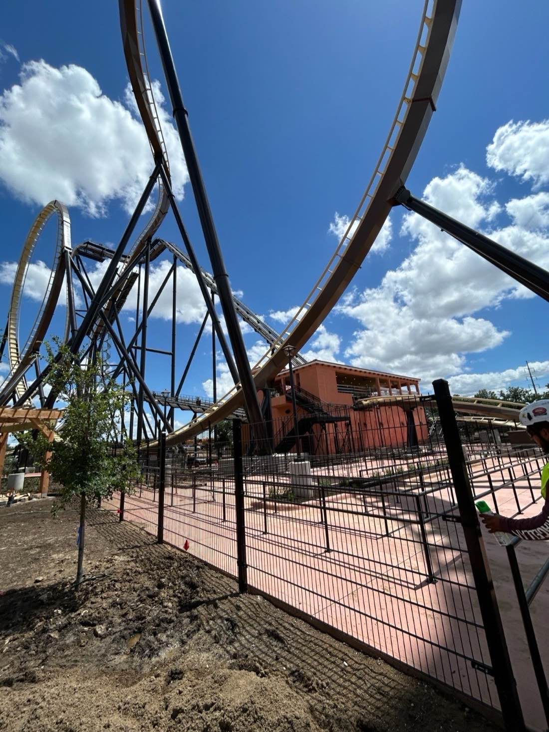 Black Fenceweb welded wire fence panels along the perimeter of a new roller coaster area at Six Flags in Dallas, Texas